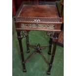 A Gothic Chippendale Revival mahogany kettle stand, square top with pierced gallery above a slide,