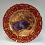 A Royal Worcester shaped circular plate, painted by Richard Seabright, with plums and raspberries,