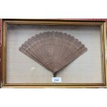 A Chinese boxwood nineteen-stick brise fan,