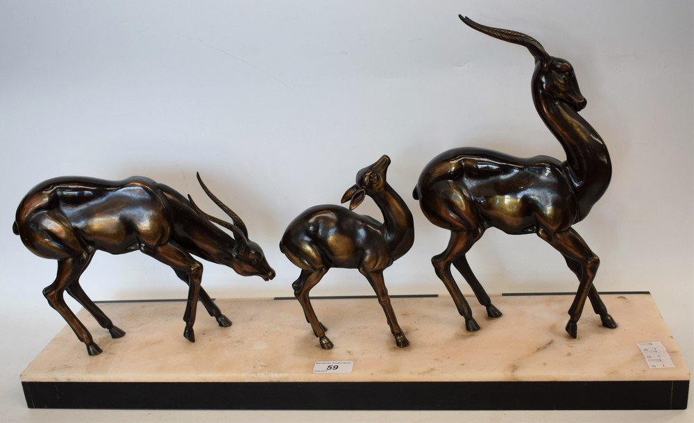 A bronzed metal model of a family of three gazelles, on marble base, c.1930, 65.