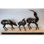 A bronzed metal model of a family of three gazelles, on marble base, c.1930, 65.