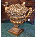 A substantial gilt centrepiece, as a well potted fluted campana urn,