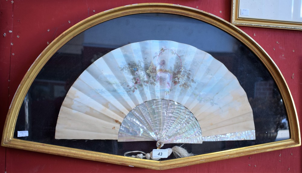 A 19th century French fan, painted by Jolivet, signed with beauty amongst flowers and foliage,