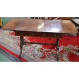 A Regency mahogany rounded rectangular sofa table, crossbanded top above a pair of frieze drawers,