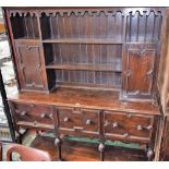 A 17th century style oak blockfront dresser,