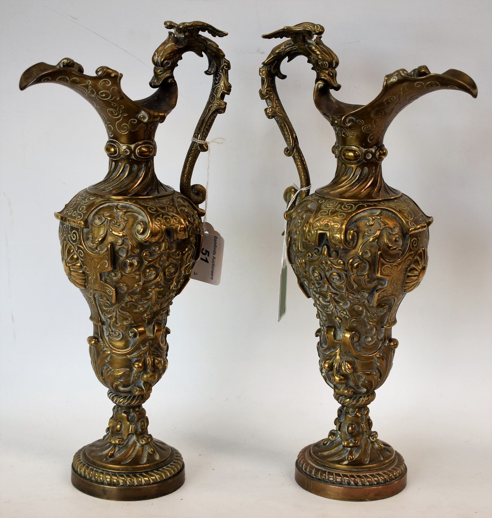 A pair of 19th century French Renaissance Revival gilt-patinated bronze ewers,