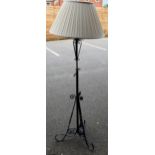 A late 19th/early 20th century wrought metal telescopic standard lamp,