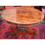 A William IV rosewood circular centre table, moulded top with book-matched veneers,