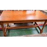 A 20th century oak refectory type dining table, rectangular top, turned supports,