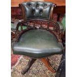 A Victorian design swivel office/captain's chair, deep button back, turned gallery, serpentine seat,