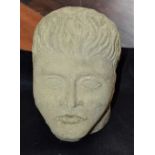 An 18th century 'Gothick' limestone corbel, carved as the head of a man,