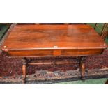 A Victorian rosewood library table, rounded rectangular top above a single frieze drawer,