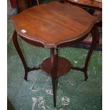 An Edwardian mahogany occasional table, moulded top above a conforming undertier, serpentine legs,