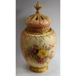 A large Royal Worcester ovoid potpourri vase and cover, painted with hellebores in tones of yellow,