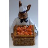 A Royal Doulton prototype novelty box and cover, as a rabbit holding a basket of carrots, approx 12.