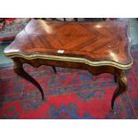 A Louis XV Revival gilt metal mounted kingwood and rosewood shaped serpentine card table,