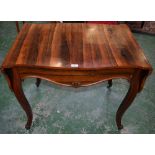 A 19th century rosewood sofa table, shaped top with fall leaves above a long frieze drawer,