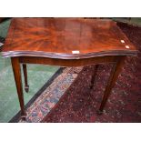 A 20th century mahogany serpentine card table, folding top enclosing a baize lined playing surface,