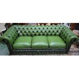 A Chesterfield type scroll arm reception sofa, deep button upholstery,