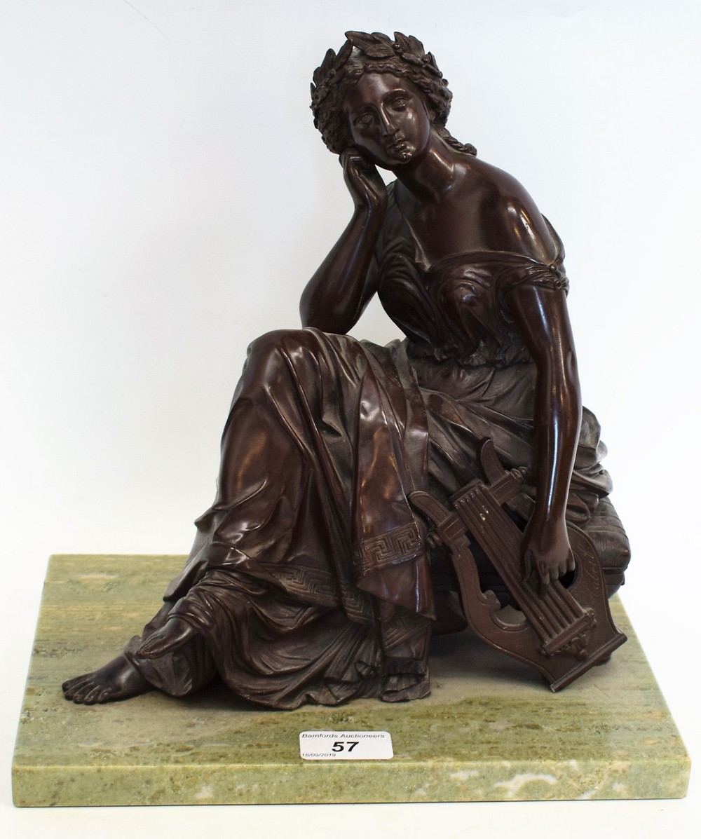 A dark patinated bronze, as a classical maiden deep in thought,