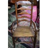 A 19th century Provincial elm ladderback armchair, serpentine arms, boarded seat, plain stretchers,