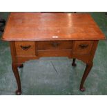 A George II oak lowboy, rounded rectangular moulded top above three drawers,