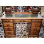 A Victorian oak 'Dickens' type writing desk, the galleried superstructure with four small drawers,