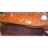 A Victorian mahogany rounded rectangular wind-out dining table, moulded top,