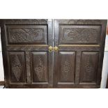 A pair of late/early 20th century Jacobethan design oak doors