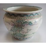 A Chinese ovoid jardiniere, painted in the Famille Rose palette,