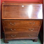 An Edwardian crossbanded mahogany bureau, fall front enclosing an arrangement of small drawers,