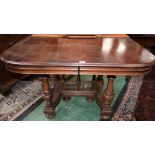 A 19th century mahogany dining table, rounded near-square top,