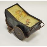 Advertising Tins - an early 20th century biscuit tin as a pram, baby and golly, painted lid,