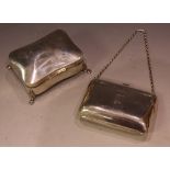 A silver dressing table box and cover, lion paw feet, Birmingham 1894; a silver evening purse,