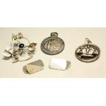 A silver fob; an Arts and Crafts silver brooch; a silver Libra pendant;