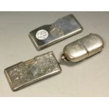 A silver vesta and sovereign case, Birmingham 1895; a silver card sleeve, Birmingham 1895; another,