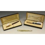 A Waterman pen with 14ct nib; another;