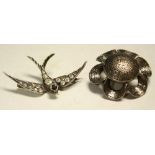 A hallmarked silver stone set swallow brooch;