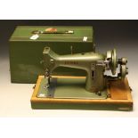 A mid-20th century hand-crank Jones sewing machine, Family C.S.