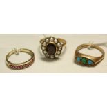 A 9ct gold turquoise dress ring, 3.9g; a 9ct gold ruby half eternity ring, 2.