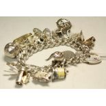 A hallmarked silver charm bracelet and padlock,