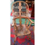 A Country House Windsor elbow chair, shaped and pierced splat,