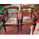 A pair of Regency mahogany open armchairs/carvers, curved cresting rail above a conforming mid-rail,