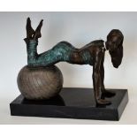 A contemporary bronzed metal figure, of a gym girl,