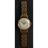 Longines - a retro 1970s lady's 9ct gold cased bracelet wristwatch, silvered dial, Arabic numerals,