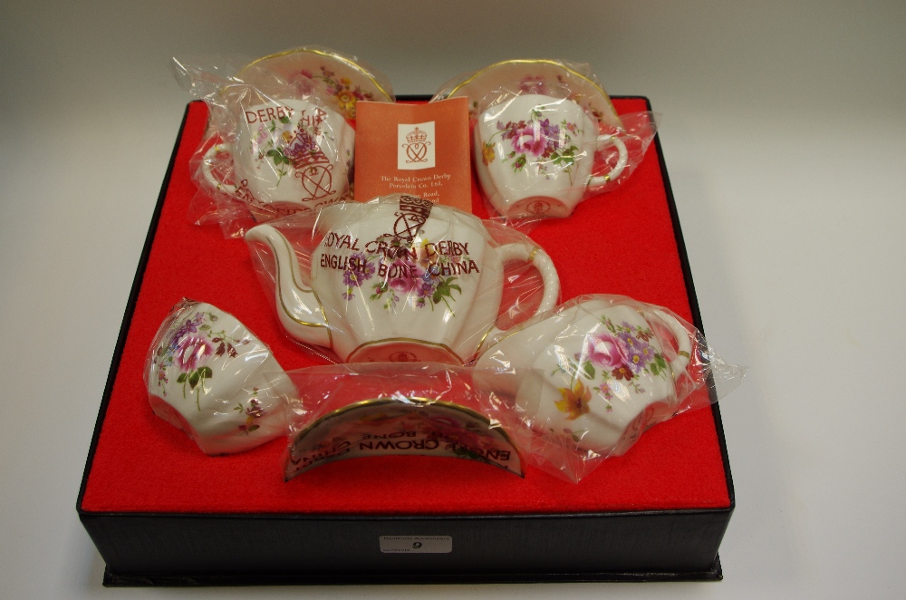 A Royal Crown Derby, Derby Posies pattern tea for two setting,