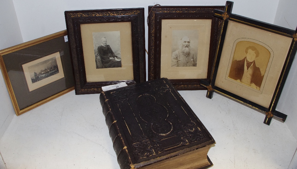 A 19th century bible, leather bound, 1860; late Victorian photographs; an engraving,