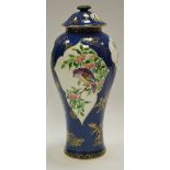 A Wedgwood slender inverted baluster vase and cover decorated with birds amongst flowering stems,