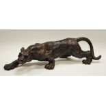 A cast metal prowling panther