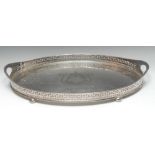 An Adam Revival E.P.N.S oval gallery tray, pierced border, bun feet, 56.5cm wide, c.